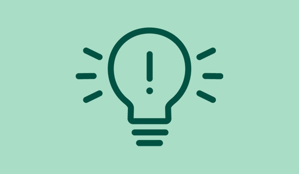 Illustration av glödlampa med ett utropstecken i. 